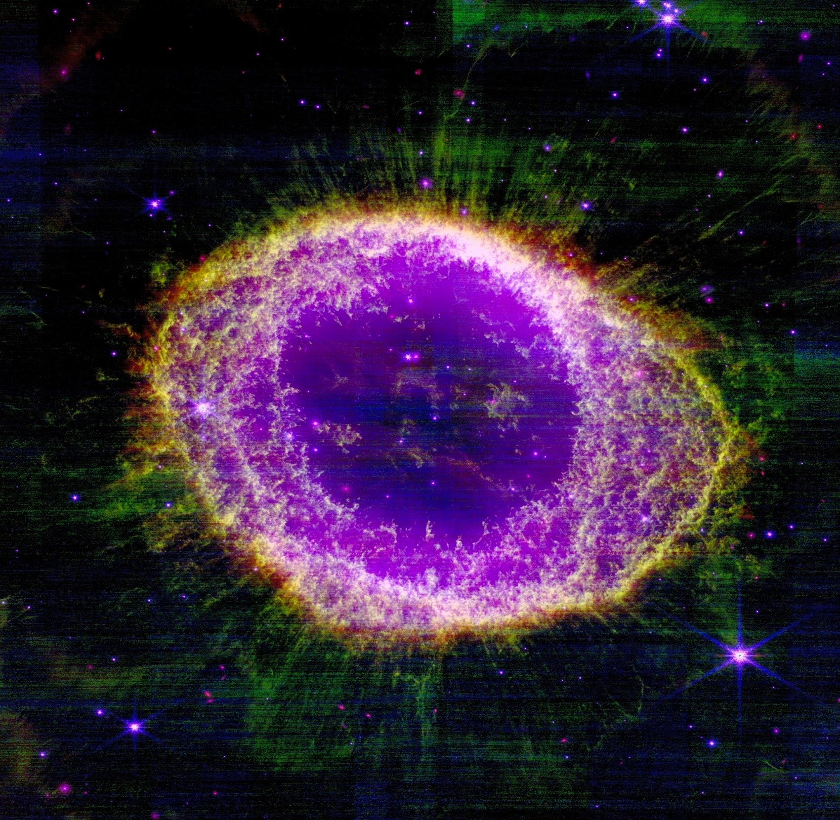 JWST's NIRCam view of the Ring Nebula, reprocessed by Kyle Eberly — a knotted ring of green and gold gas around a purple interior, against a dark sky.